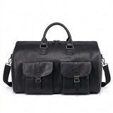 Black leather duffel bag with shoulder strap on a white background