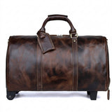 Brown leather duffel bag with wheels on a white background