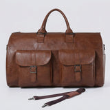 Brown leather duffel bag with a strap on a white background